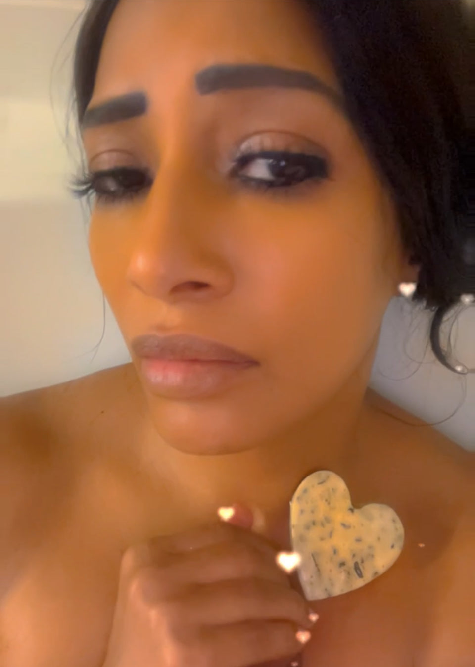 Load video: Lady taking a bath using a heart shaped 100% All- Natural Soap to protect her skin from harmful chemicals